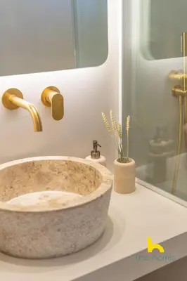 a bathroom with a large stone sink on a counter at Eagle's Nest Athens Oasis with Culture & Views! in Athens