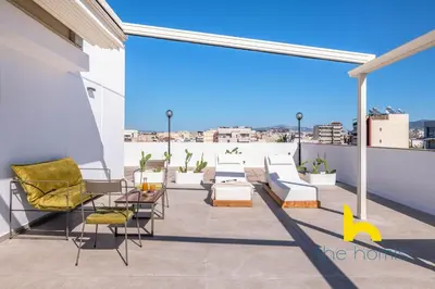 a patio with chairs and tables on a roof at Eagle's Nest Athens Oasis with Culture & Views! in Athens