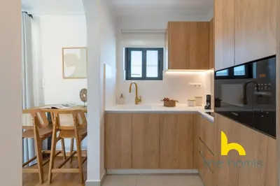 a kitchen with a sink and a stove top oven at Eagle's Nest Athens Oasis with Culture & Views! in Athens