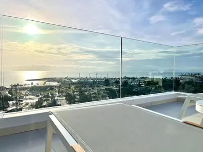 a balcony with a view of the ocean at Penthouse with private pool and unlimited Sea View in Glyfádas