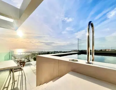a kitchen with a sink and a view of the city at Penthouse with private pool and unlimited Sea View in Glyfádas