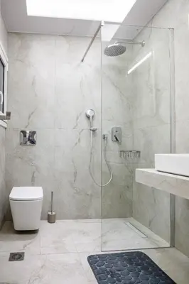 a bathroom with a shower and a toilet and a sink at Central apartment in Piraeus in Piraeus