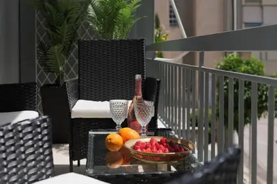 a bowl of fruit on a table on a balcony at Rhapsody in Blue Alimos Marina in Athens