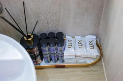 a tray with a group of bottles on a table at Rhapsody in Blue Alimos Marina in Athens