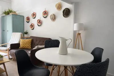 a living room with a white table and chairs at Athens City Staying in Athens
