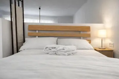 a bedroom with a bed with white towels on it at Athens City Staying in Athens
