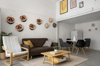 a living room with a couch and a table at Athens City Staying in Athens