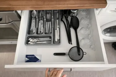 a drawer with utensils and a magnifying glass in it at Athens City Staying in Athens