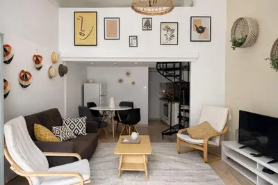 a living room with a couch and chairs and a table at Athens City Staying in Athens