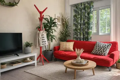 a living room with a red couch and a tv at Athens City Staying in Athens