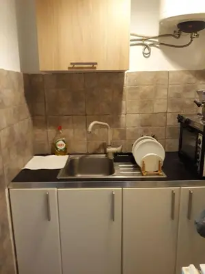 a kitchen with a sink and a counter top at Studio Poseidonos Avenue in Athens