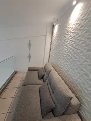 a row of brown pillows in a room at Lula Urban Apartment in Athens