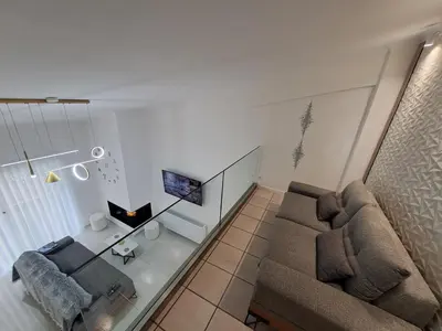 an overhead view of a living room with a couch at Lula Urban Apartment in Athens