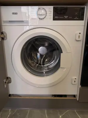 a white washing machine with its door open at Monda Apartment 3 in Piraeus