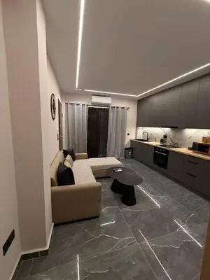 a living room with a couch and a table at Monda Apartment 3 in Piraeus