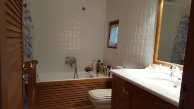 a bathroom with a tub and a toilet and a sink at Villa Horizon Bleau by A&D Properties in Sounio
