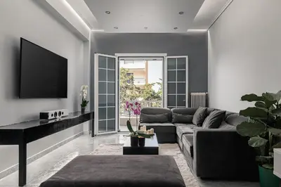 a living room with a couch and a piano at Eclipse Asklipion Voula in Athens
