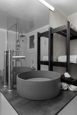 a bathroom with a large tub in the middle of it at Eclipse Asklipion Voula in Athens
