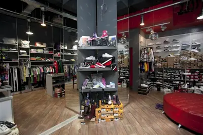 a store with shoes on shelves in a store at Apartments in Pereas in an ideal location in Piraeus