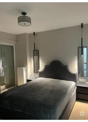 a bedroom with a large bed in a room at Spacious 2-Bedroom Apartment in Paleo Faliro, Athens in Athens