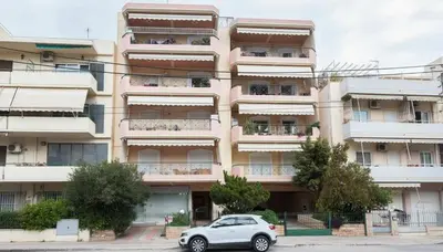 a car parked in front of a building at Premium 2 Bd Blue Retreat in Kallithea in Athens