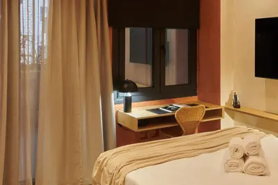 a bedroom with a bed and a desk and a mirror at V13 Boho Suite in Athens