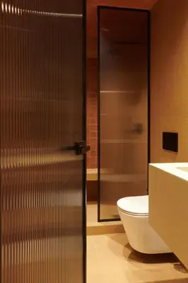 a bathroom with a shower and a toilet and a sink at V13 Boho Suite in Athens