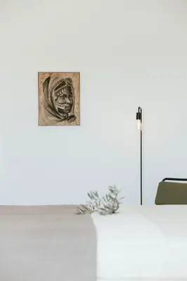 a white table with a picture on the wall at Athens Riviera Villa overlooking the Aegean sea in Anavissos