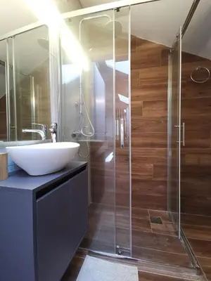 a bathroom with a sink and a shower at Athenean Rooftop Nest in Athens