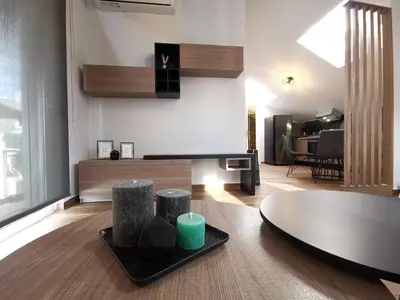 a living room with a couch and a table at Athenean Rooftop Nest in Athens