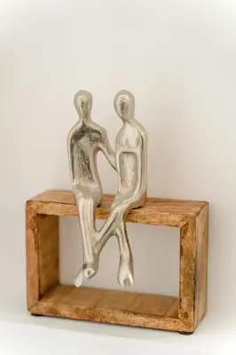 two metal mirrors sitting on a wooden stand at Villa Oneiron in Anavissos