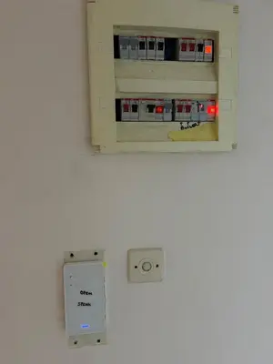 a wall with an electrical socket and an outlet at Cosy executive room in beautiful n quiet flat in Athens
