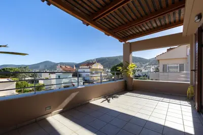 a balcony with a view of a city at Villa Elysia in Porto Rafti