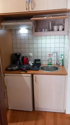a kitchen with a sink and a counter top at Pavlos apartment in Leondárion