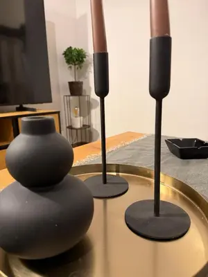 two speakers on a table with a vase on it at Modern studio apartment in Athens