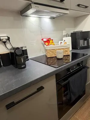 a kitchen counter with a basket on top of it at Modern studio apartment in Athens