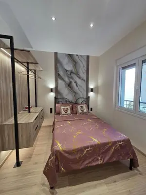 a bedroom with a large bed in a room at 3siblings Β2 in Athens