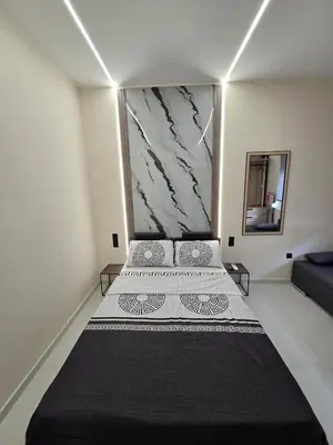 a bedroom with a large bed in a room at 3siblings A2 in Athens