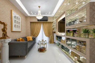 a living room with a couch and a chandelier at Crystal Parthenon - Luxury Design Apartment near Acropolis in Athens