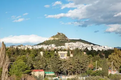 a city on top of a hill with trees at Crystal Parthenon - Luxury Design Apartment near Acropolis in Athens