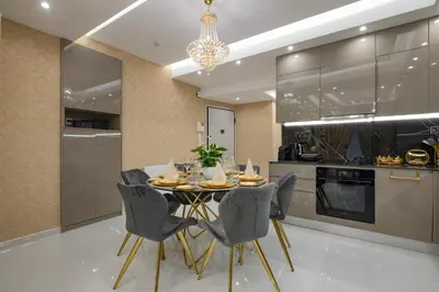 a dining room with a table and chairs in a kitchen at Crystal Parthenon - Luxury Design Apartment near Acropolis in Athens