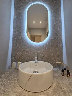 a bathroom with a sink and a mirror at 3siblings A1 in Athens