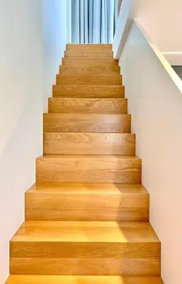 a staircase with wood treads in a house at 2BR Sea View Loft with private Jacuzzi in Riviera in Athens