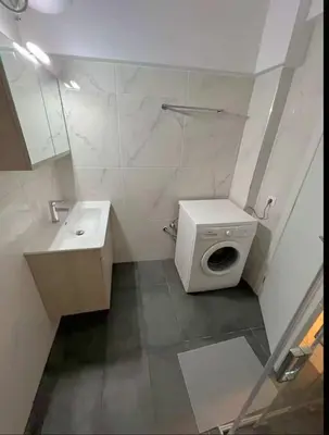 a small bathroom with a toilet and a sink at Seaside Comfort Stay apartment in Athens