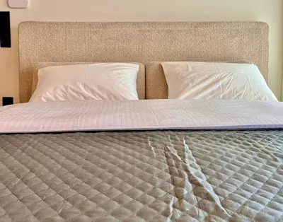 a close up of a bed with two pillows at Athenian Riviera Hideaway, 1 BR in Glyfada in Athens