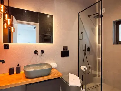 a bathroom with a sink and a shower at Top Floor Elegant Escape in Glyfada Center in Athens
