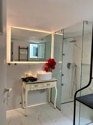 a bathroom with a sink and a shower at Dreaming of Greece G2 in Athens