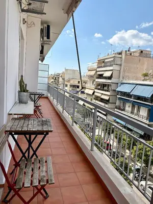 a balcony with benches and a view of buildings at Dreaming of Greece G2 in Athens