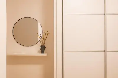 a mirror on a shelf next to a door at Vote Athens Apartment in Athens