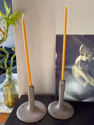 a group of three candles sitting on a table at Elegant 2BR Apartment near Metro, Sunny & Spacious in Athens